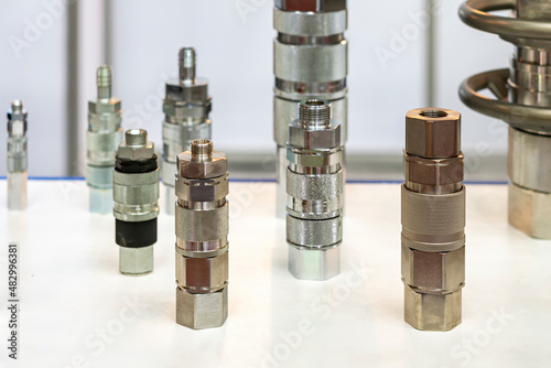 various type metal multi quick coupling connector or high pressure hose fitting device for pneumatic hydraulic system or air fluid transfer of  industrial on table photo