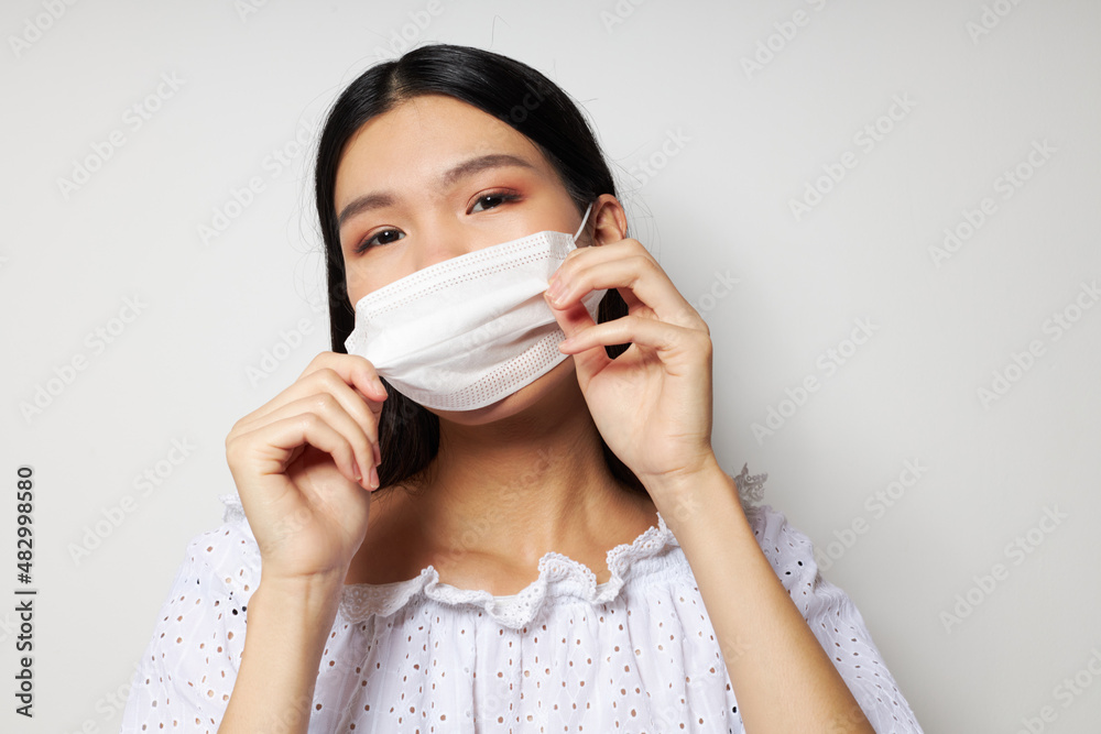 pretty brunette medical mask on the head protection studio model unaltered pretty brunette medical mask on the head protection studio model unaltered