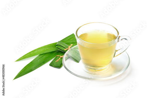 Pandan tea with fresh leaves isolated on white background.