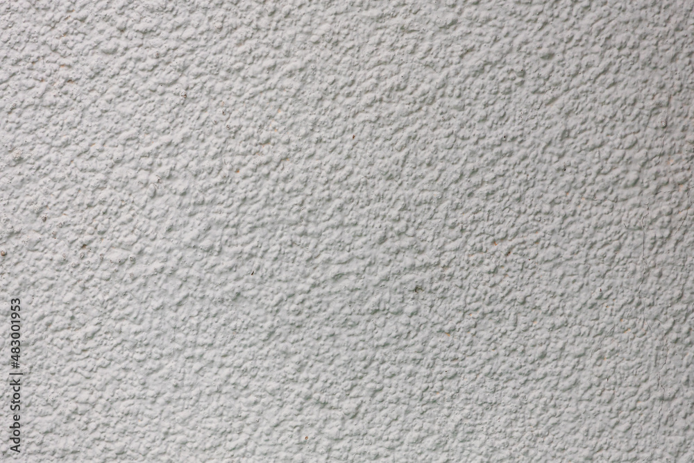 Background from a pattern of gray stone wall covered with decorative plaster. Background from a pattern of gray stone wall covered with decorative plaster.