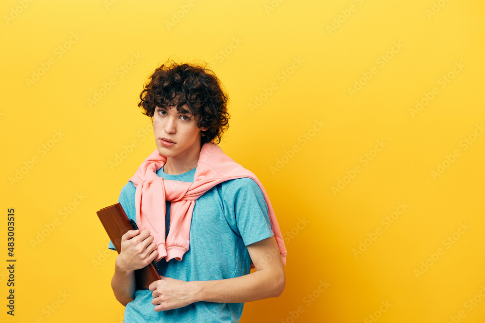 guy with a book college learning pink jacket yellow background guy with a book college learning pink jacket yellow background