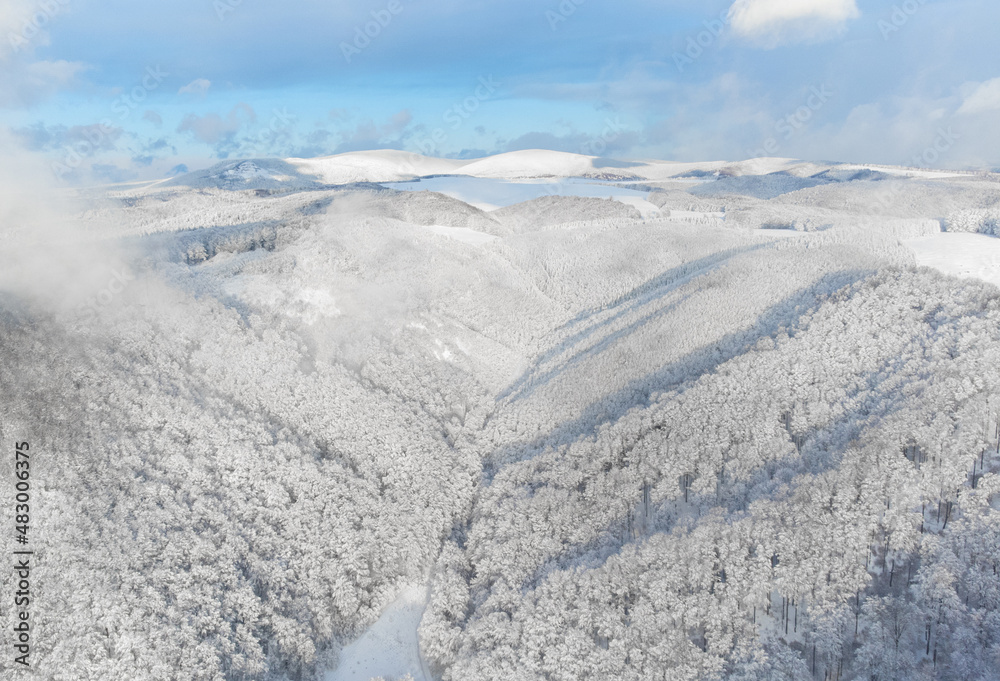a beautiful aerial landscape with the Calimani mountains in winter