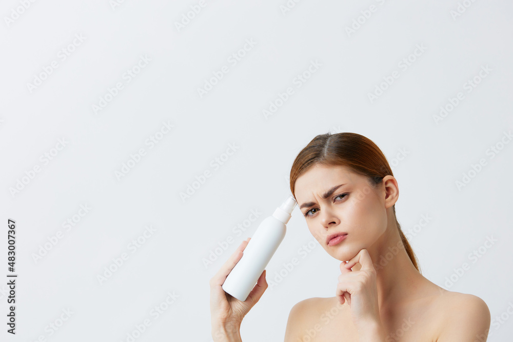 beautiful woman skin care lotion with bare shoulders close-up Lifestyle