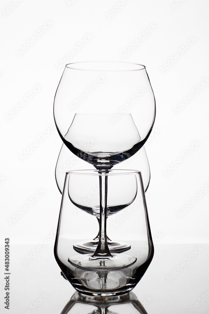 Empty wine glasses on a white background. beautiful still life Empty wine glasses on a white background. beautiful still life