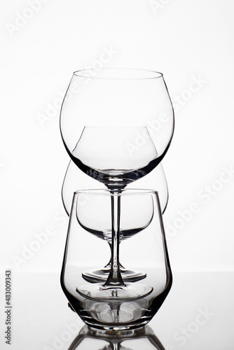 Empty wine glasses on a white background. beautiful still life
