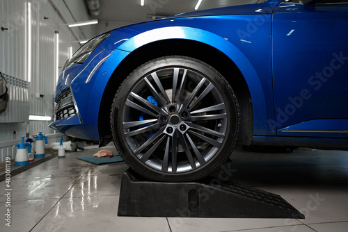 Front wheel of modern blue sport car © fotofabrika