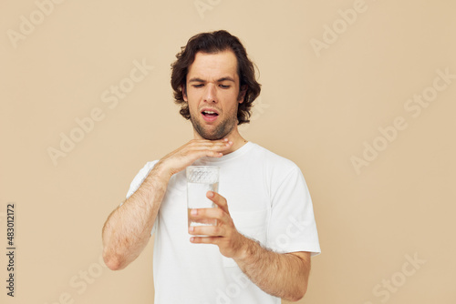 Cheerful man with a white mug in his hands emotions posing isolated background
