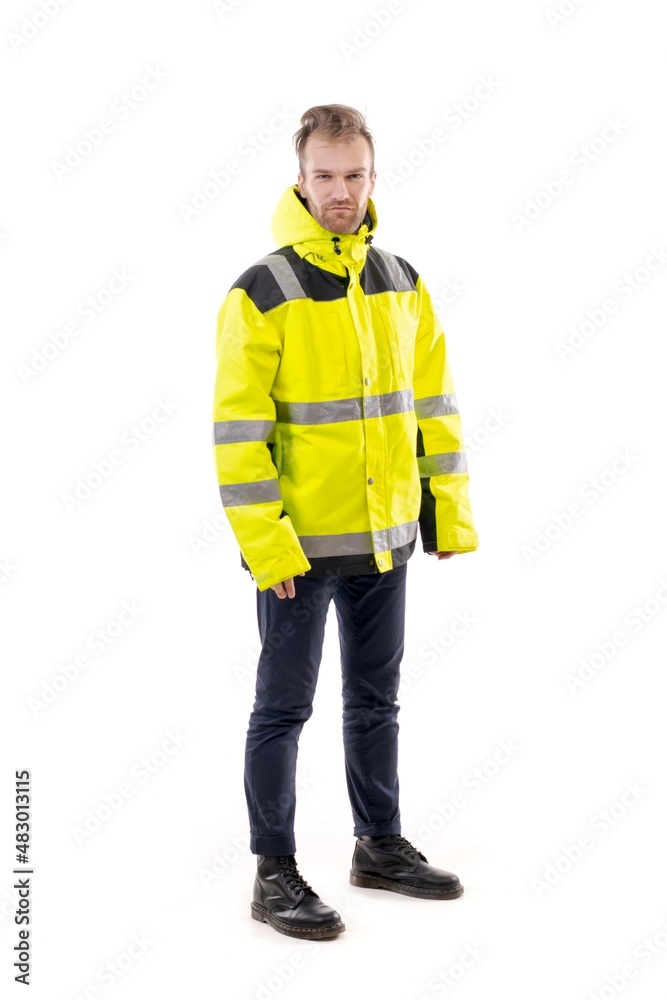 A middle-aged white man wearing a green working uniform standing over isolated white background looks happy. Worker and builder concept.