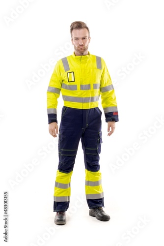 A middle-aged white man wearing a green working uniform standing over isolated white background looks happy. Worker and builder concept.