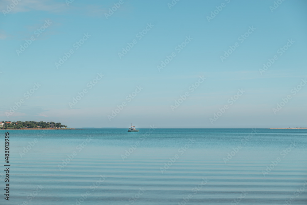 view of small boat in calm sea water