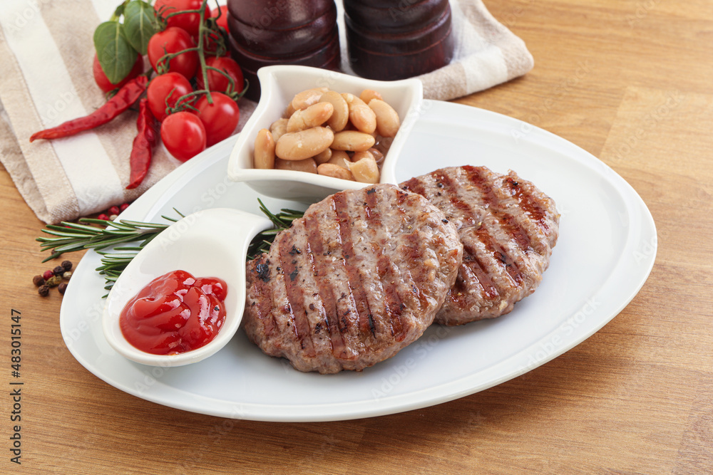 Grilled beef burger cutlet with sauce Grilled beef burger cutlet with sauce