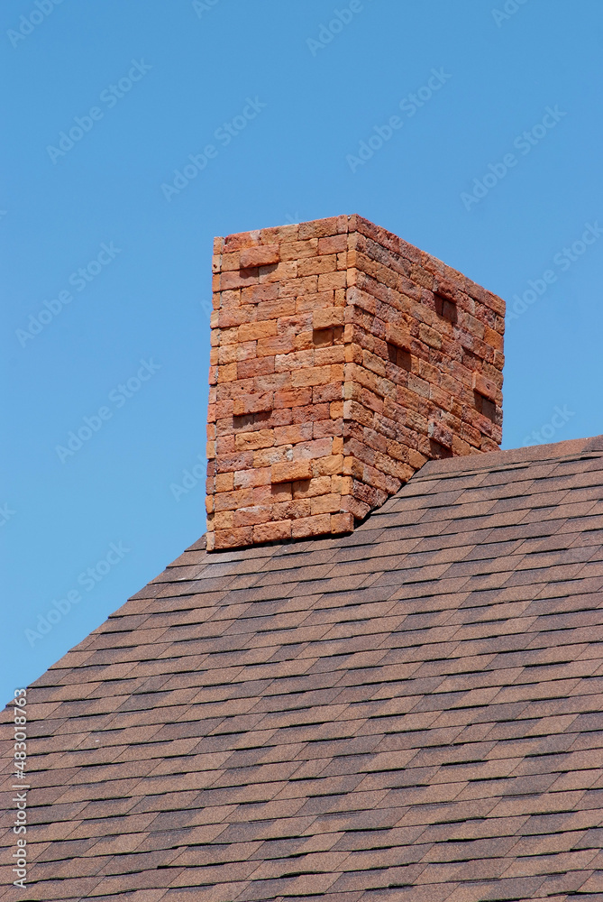 Close up brick chimney on the roof