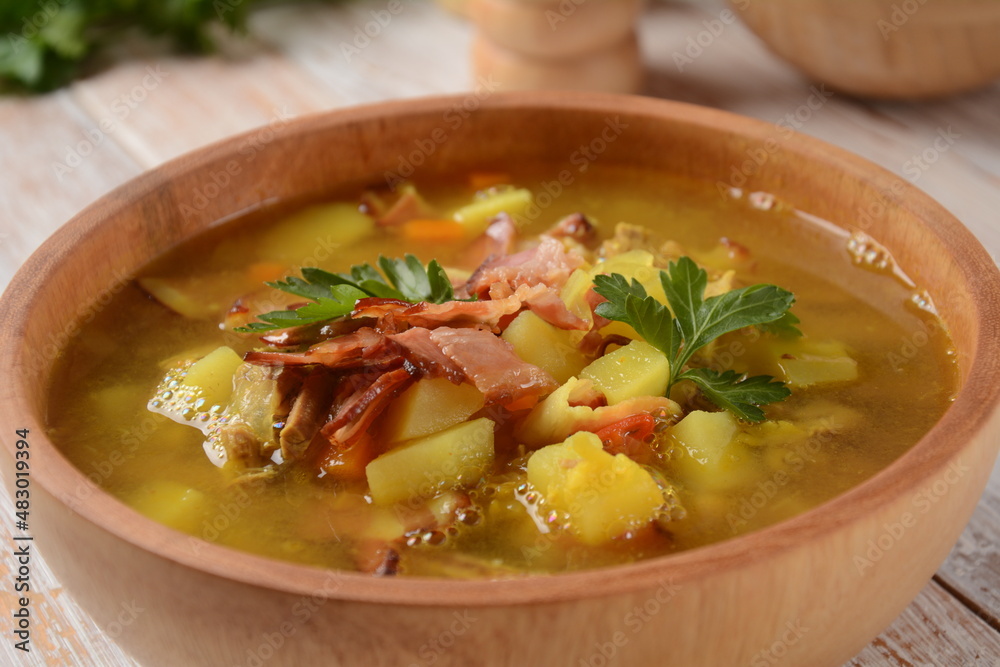 Lentil pea soup garnish with bacon, fried onion and croutons Lentil pea soup garnish with bacon, fried onion and croutons
