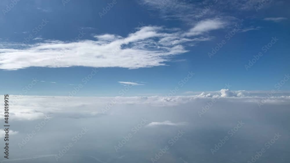 clouds behind the plane window clouds behind the plane window