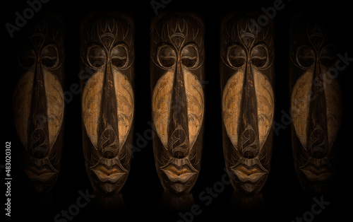African Art Masks over black background