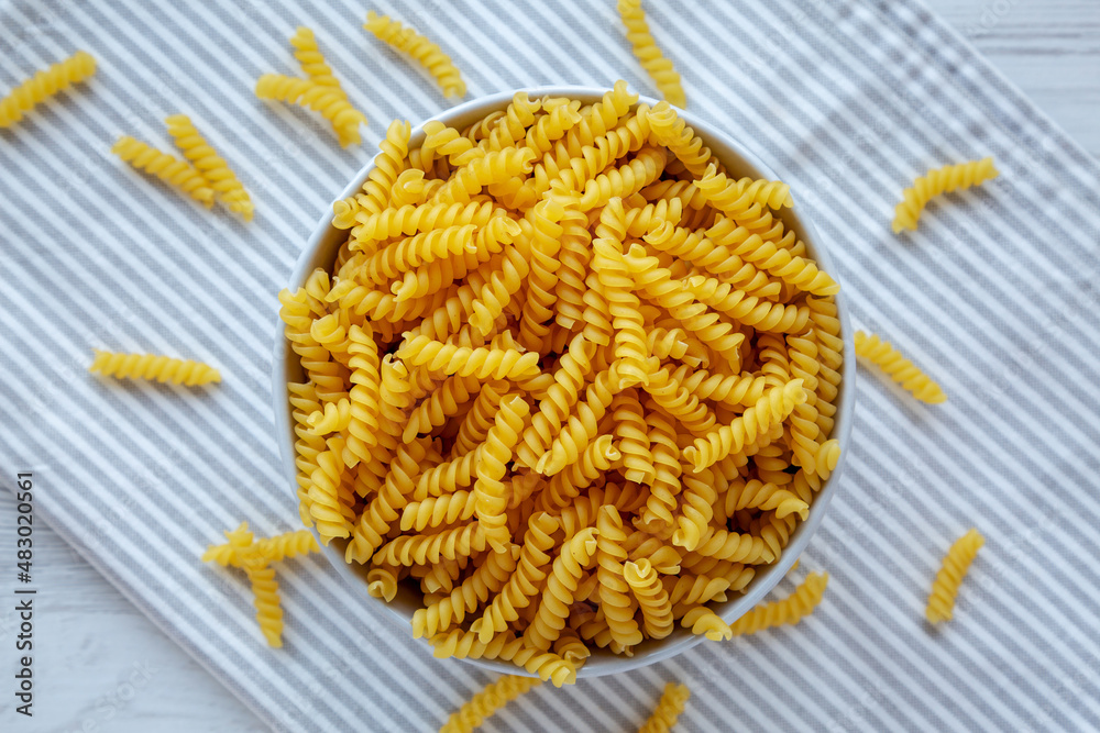 Raw Dry Organic Rotini Pasta Ready to Cook. Top view, from above, flat lay. Raw Dry Organic Rotini Pasta Ready to Cook. Top view, from above, flat lay.