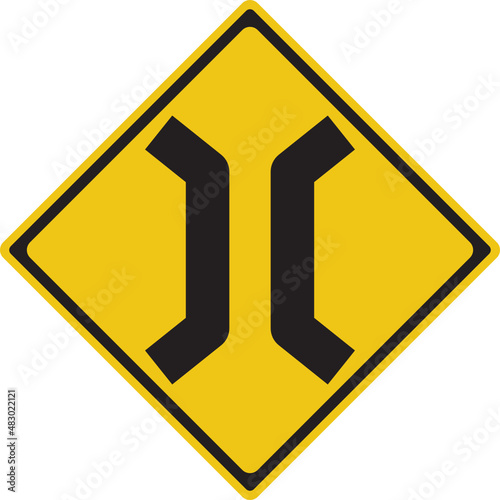 Road narrows on both sides