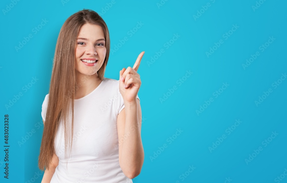 Young attractive cheerful girl demonstrating copy space ad Young attractive cheerful girl demonstrating copy space ad