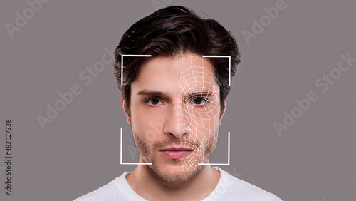 Obraz na plátně Young man experiencing face scanning, face id