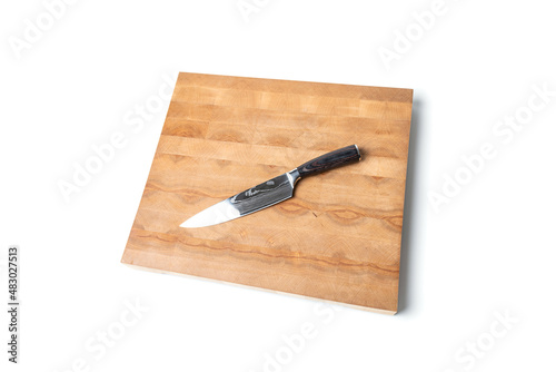 large sharp kitchen knife on a wooden board