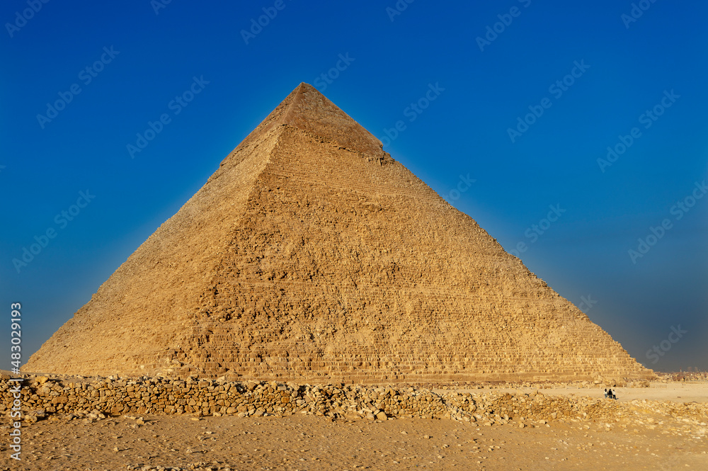 The Pyramid of Chephren, the Pyramid of Menkaure and its companions in the sands of Giza desert, Egypt The Pyramid of Chephren, the Pyramid of Menkaure and its companions in the sands of Giza desert, Egypt