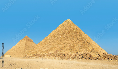 The Pyramid of Chephren  the Pyramid of Menkaure and its companions in the sands of Giza desert  Egypt