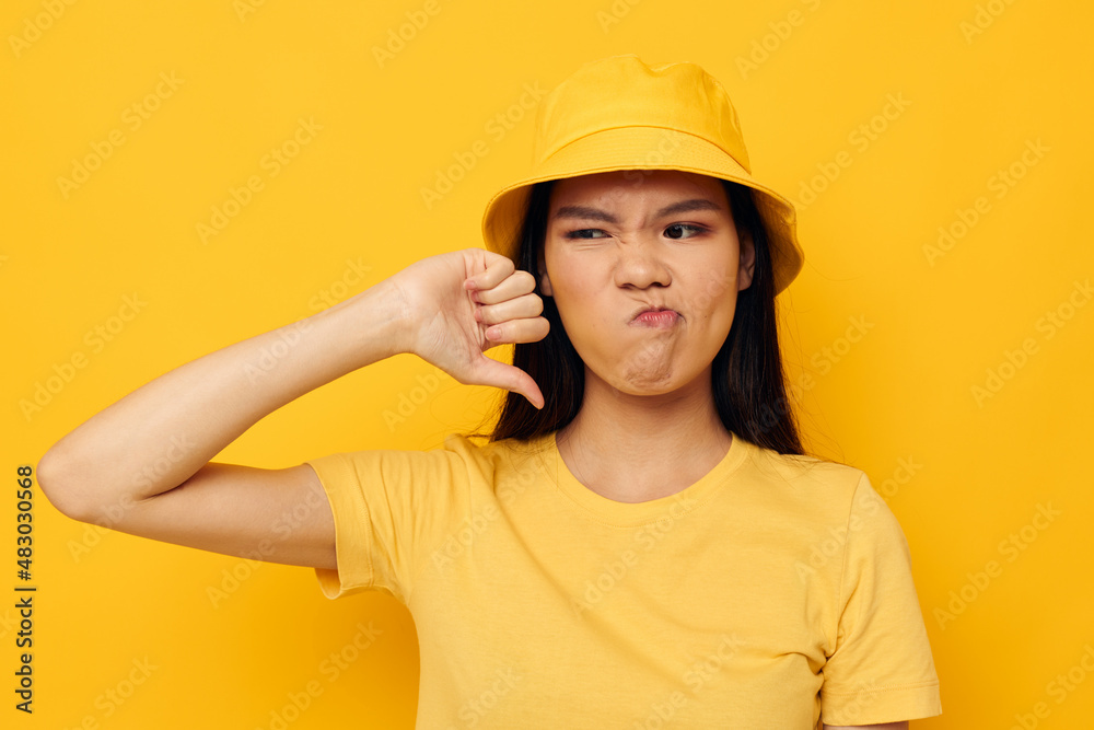 Charming young Asian woman casual wear studio hand gesture isolated background unaltered