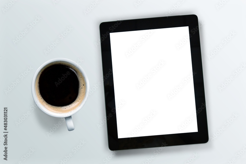 tablet computer with a cup of tea or coffee. concept business or to do list goals tablet computer with a cup of tea or coffee. concept business or to do list goals