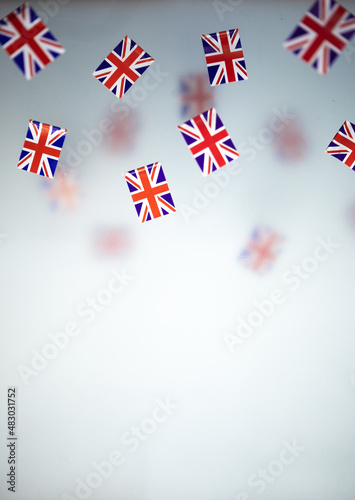 Great Britain, national holiday  country. Mini flags on a transparent foggy background. concept patriotism, pride and freedom. Platinum Jubilee of Queen Elizabeth II. photo