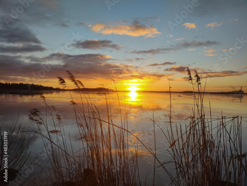 Fototapeta Naklejka Na Ścianę i Meble -  Spectacular sunset over  frozen lake in the Sweden in winter