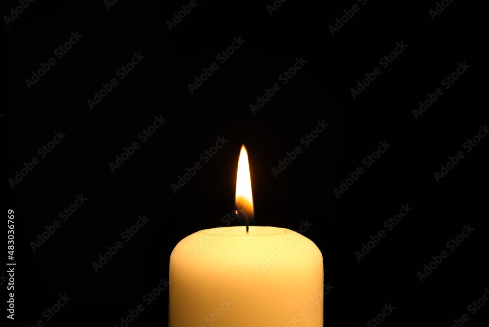 Candle flame with copy space over a black Candle flame with copy space over a black