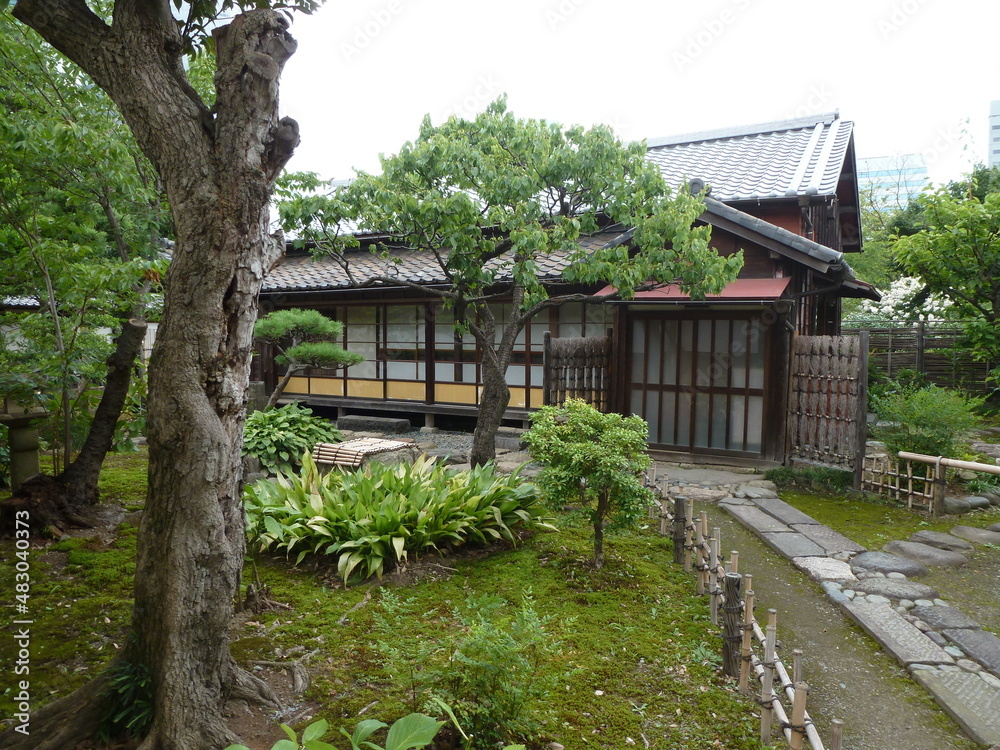Traditional Japanese framework house in quiet and peaceful Tsukishima Hamarikyu Gardens (horizontal), Tokyo, Japan