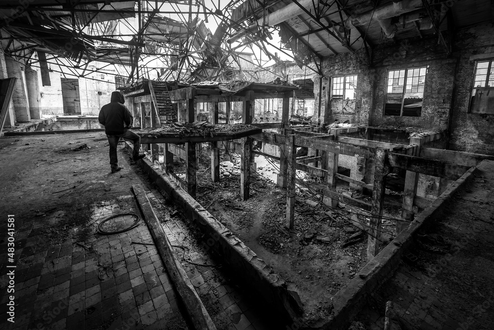 man on abandoned and ruined factory