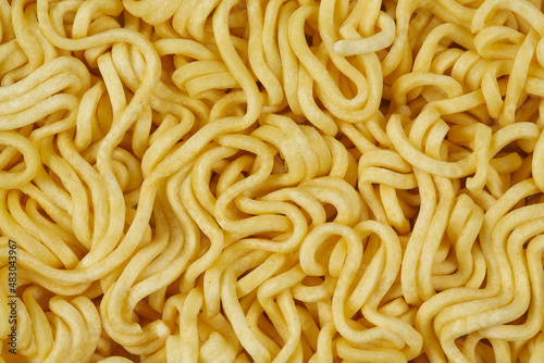 Raw egg noodles isolated on a white background.