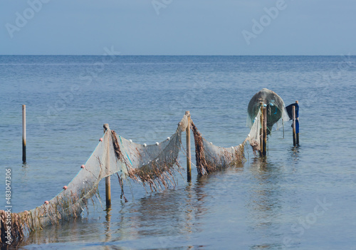Coastal fishing nets on poles used for catching shrimp. 