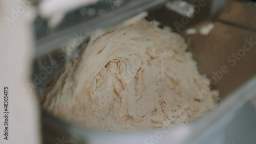 Slow Motion of Finely Grounded Almond Flour Food Processor, Grinding Almonds for Making Marzipan photo