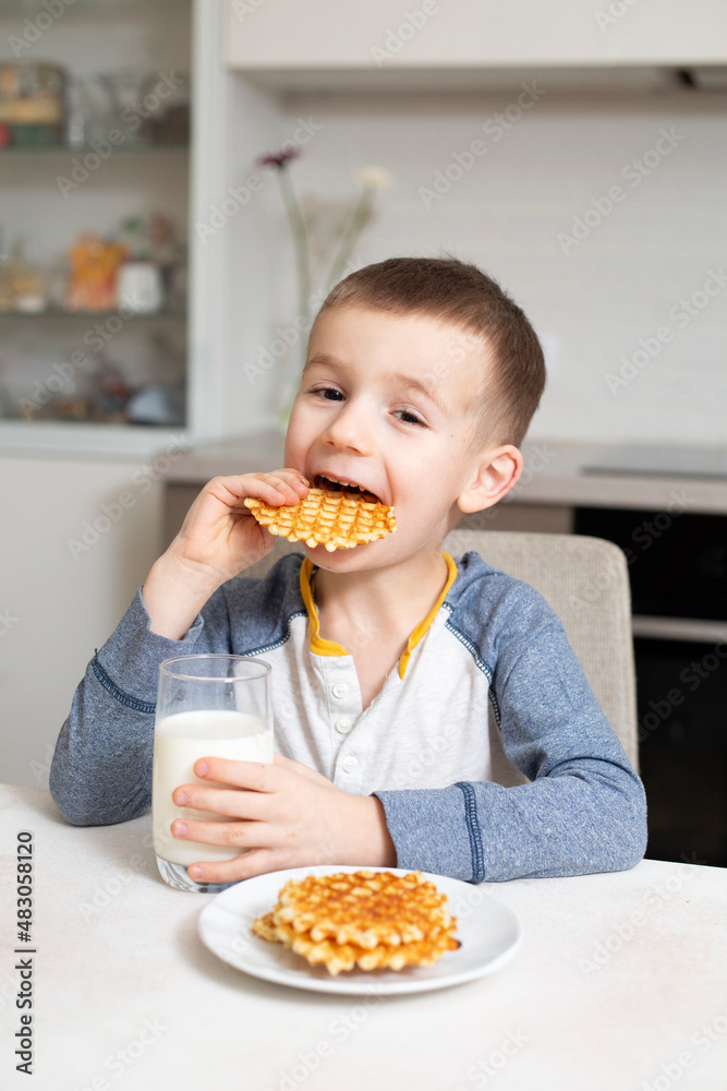 child eating a waffles child eating a waffles