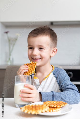 child eating cake with milk