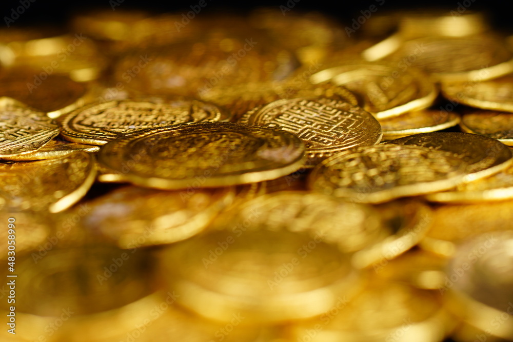 A pile of golden coins , saving money, business and financial concept . selective focus. Gold treasure A pile of golden coins , saving money, business and financial concept . selective focus. Gold treasure