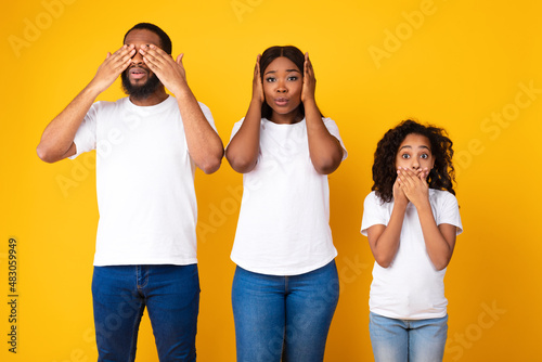 Photography African American family showing three wise monkey face