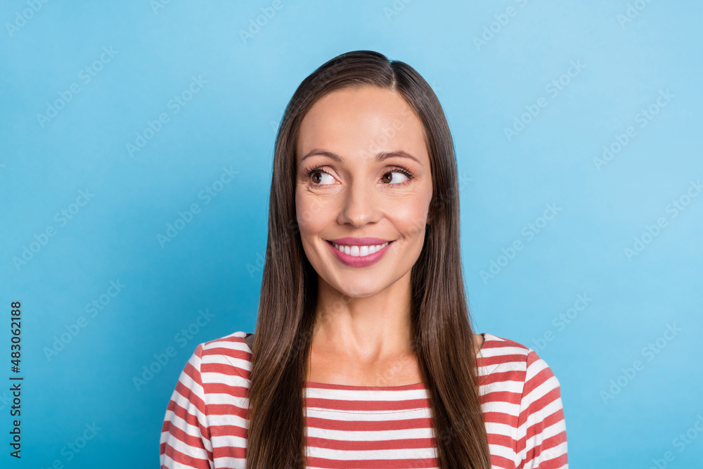 Fototapeta premium Photo of mature lovely lady look empty space guess think clever isolated over blue color background