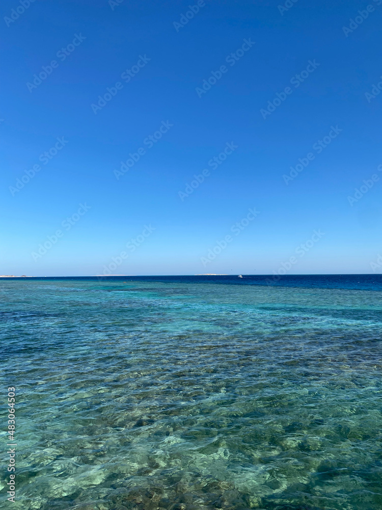 Seascape view. Coral reef. Blue salt water. Resort and rest.