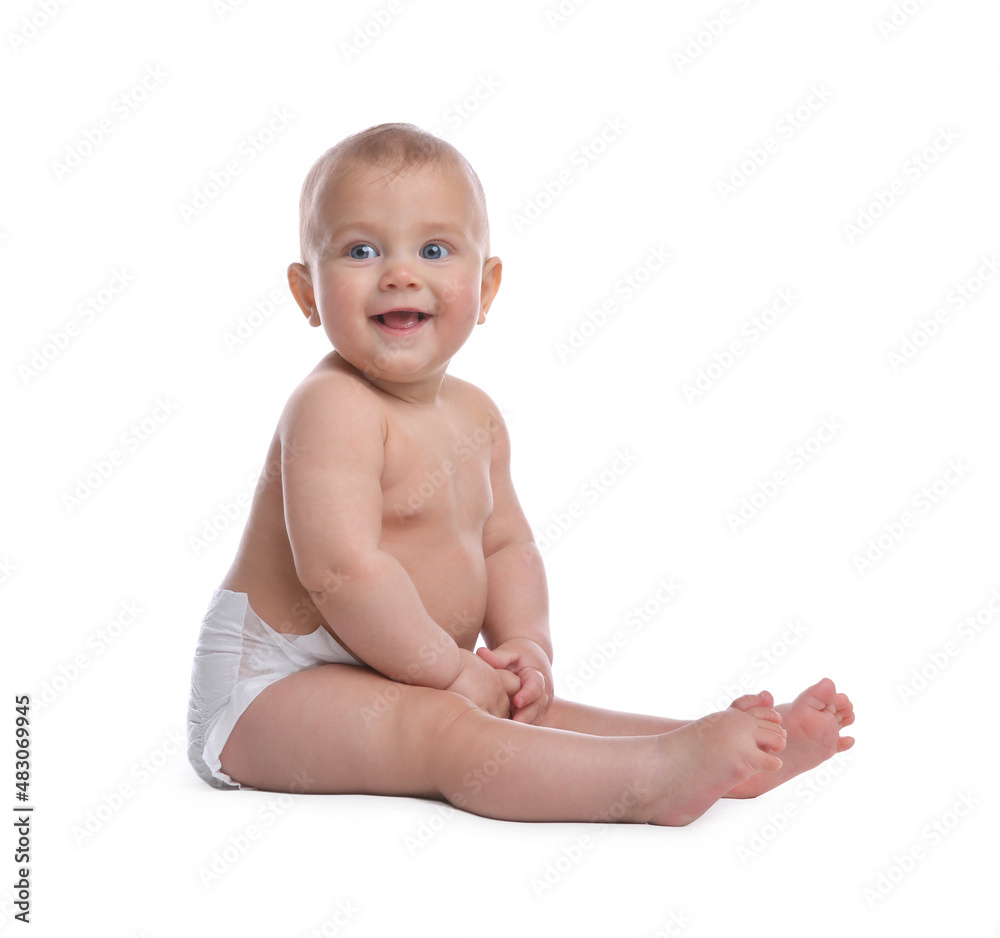 Cute baby in dry soft diaper sitting on white background Cute baby in dry soft diaper sitting on white background