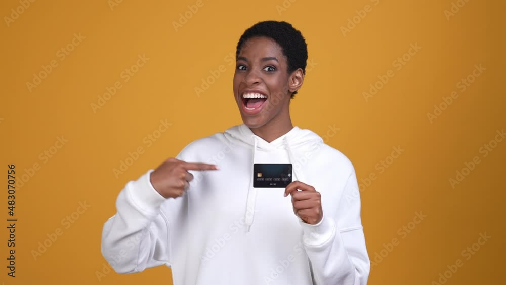 Bisexual lady guy show debit card fist up isolated vibrant color background Bisexual lady guy show debit card fist up isolated vibrant color background