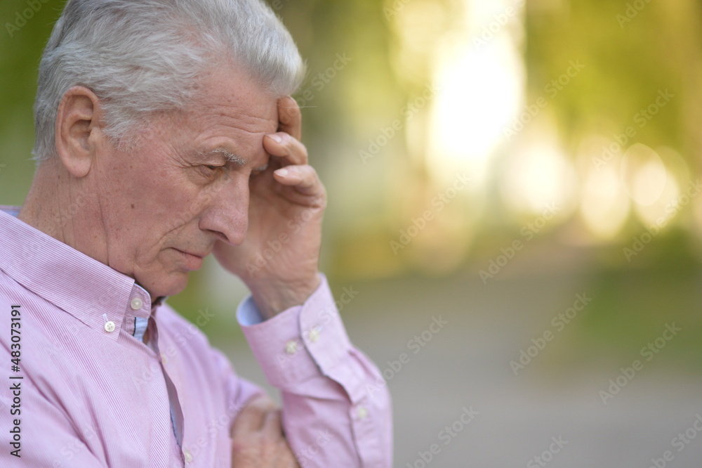 senior man in autumn park thinking senior man in autumn park thinking