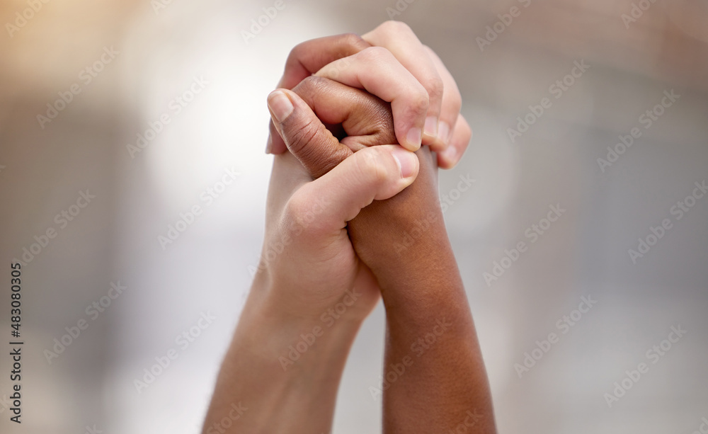 Bonded by a heartfelt cause. Shot of two people united and holding hands at a protest. Bonded by a heartfelt cause. Shot of two people united and holding hands at a protest.