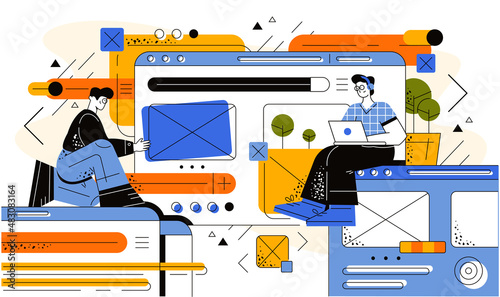 People create an interface on a huge screen. The guy sits in headphones with a laptop on a huge dashboard and studies the user interface experience. User interface design and analysis process.