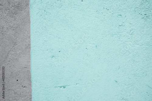 Bicolor turquoise and gray plastered wall, texture background, mock up.