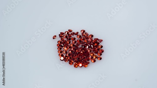 natural red round spessartins garnets gem stone on the white background photo