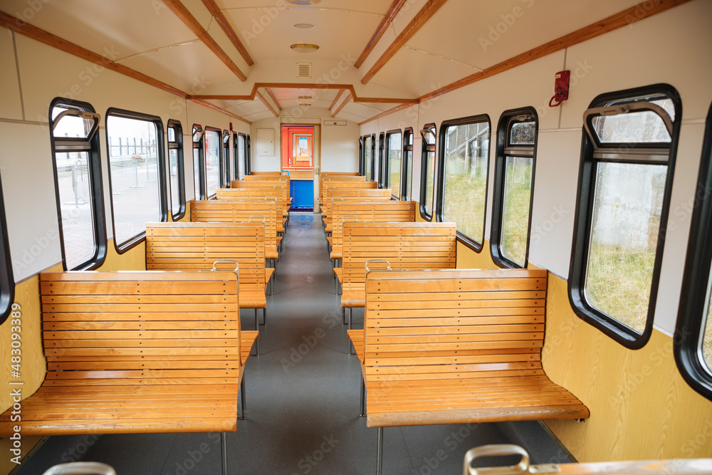 Empty train with wooden seats. Train to a North Sea island. train in Germany Empty train with wooden seats. Train to a North Sea island. train in Germany